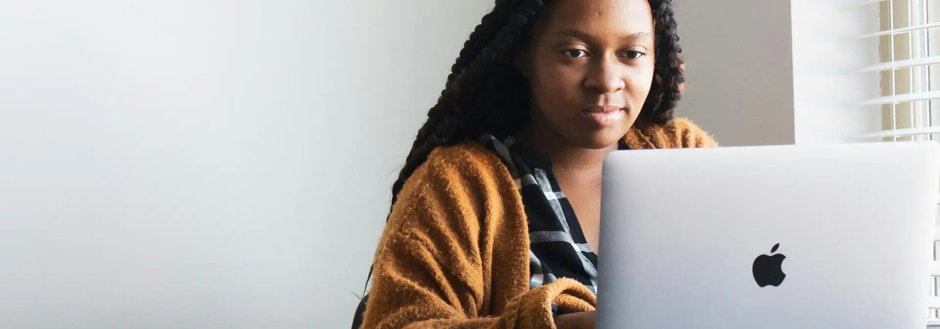 Student sitting in front of a laptop