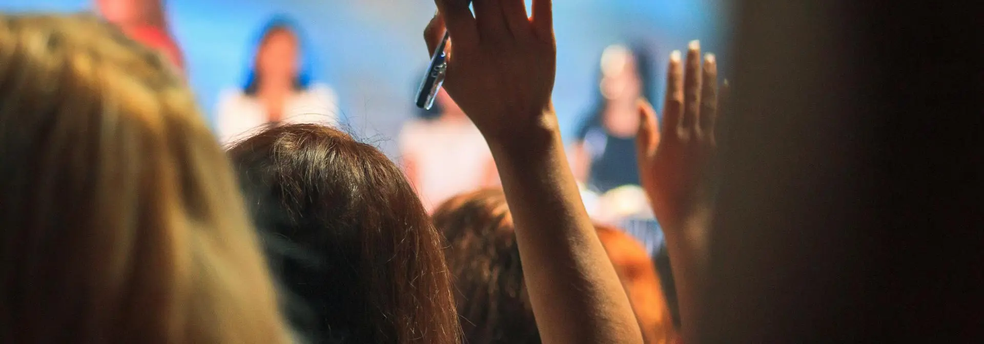 Close up of a crowd of people at a live event