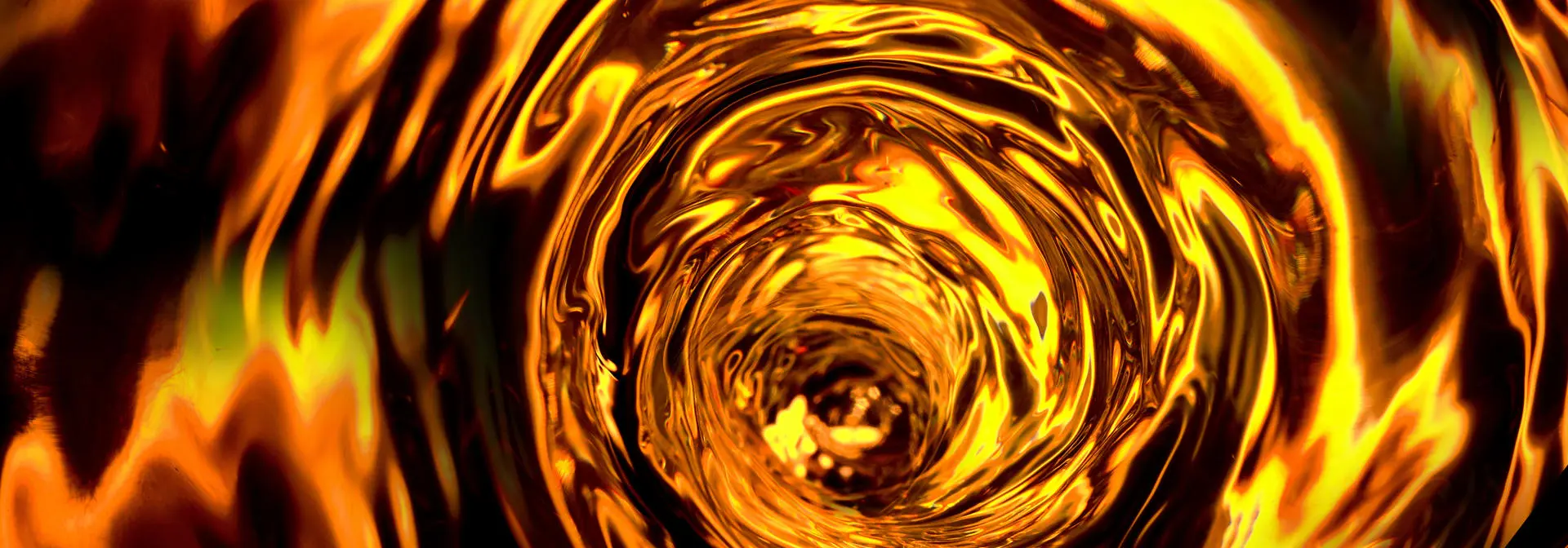 A vortex of dark amber and gold liquid