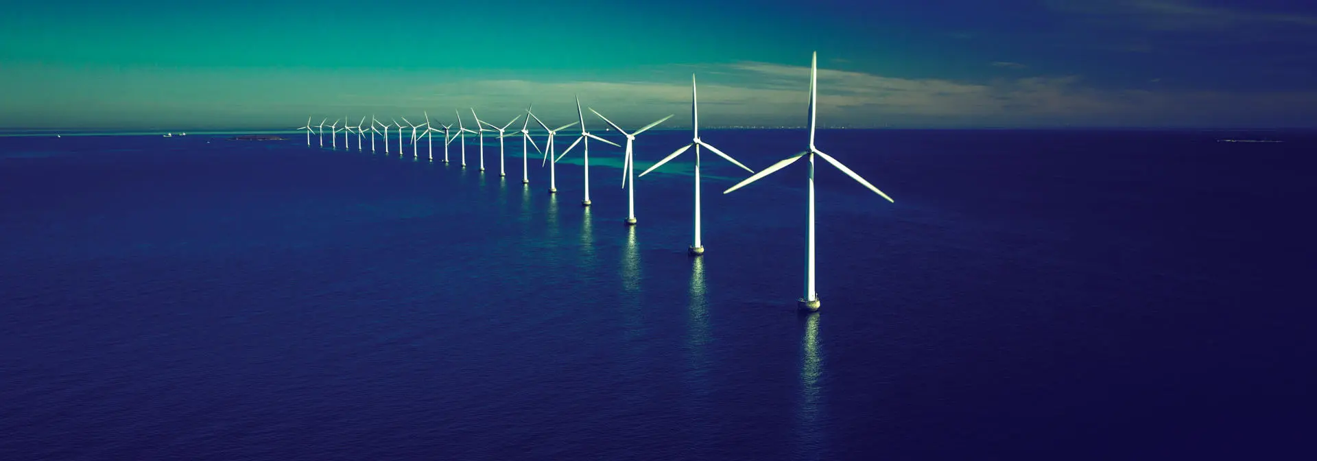 A row of offshore wind turbines
