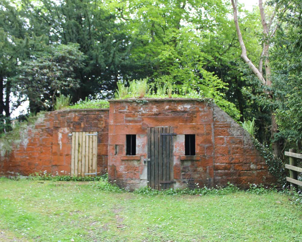 Small stone structure with two wooden doors