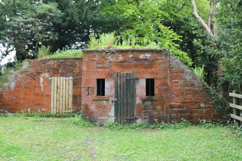 The Ice House Small stone structure with two wooden doors