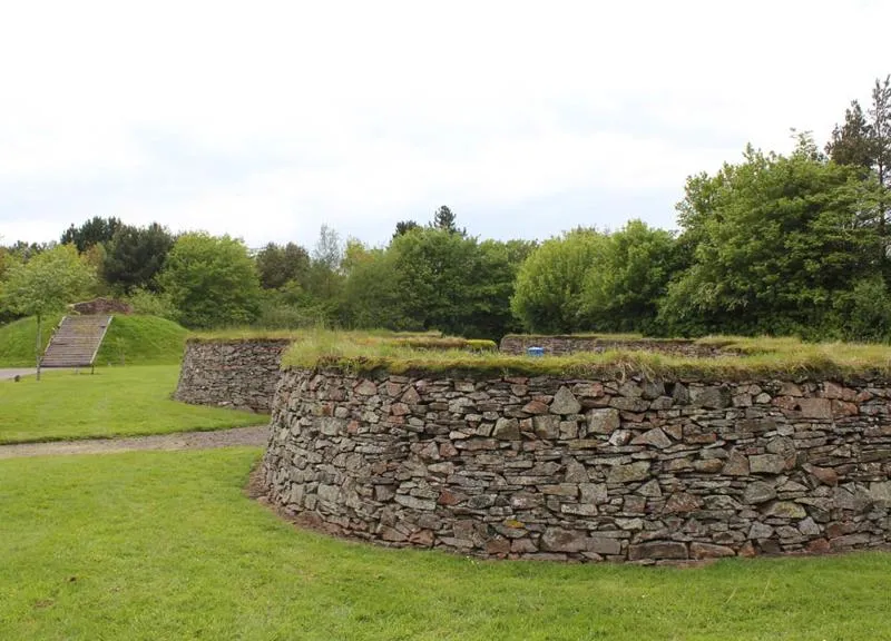 Stone enclosures beside trees