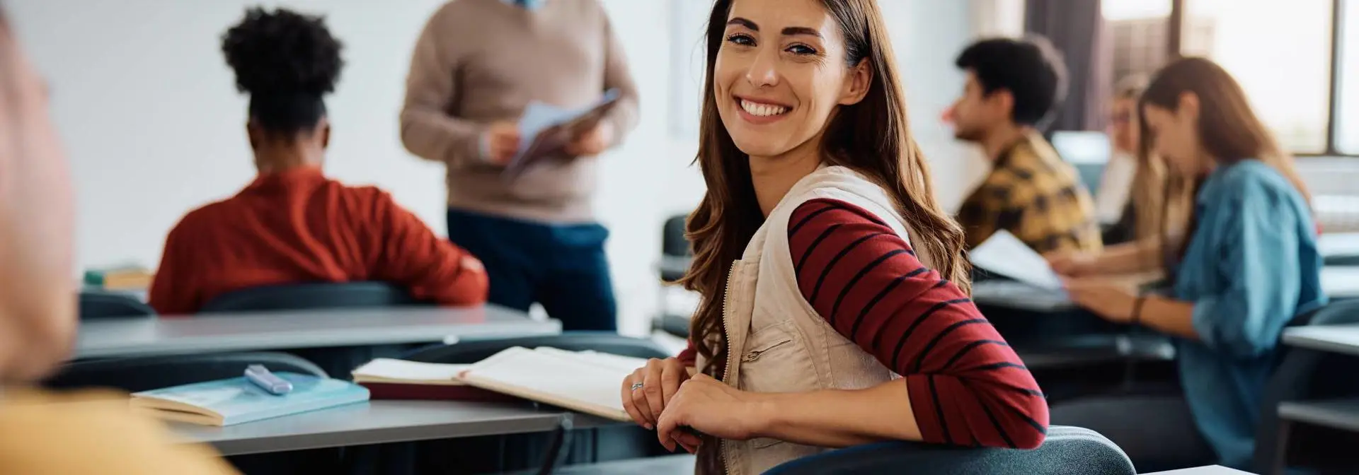 Woman in a class smiling.