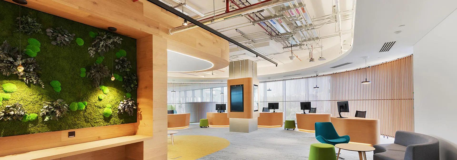 A seating area with desk and computers