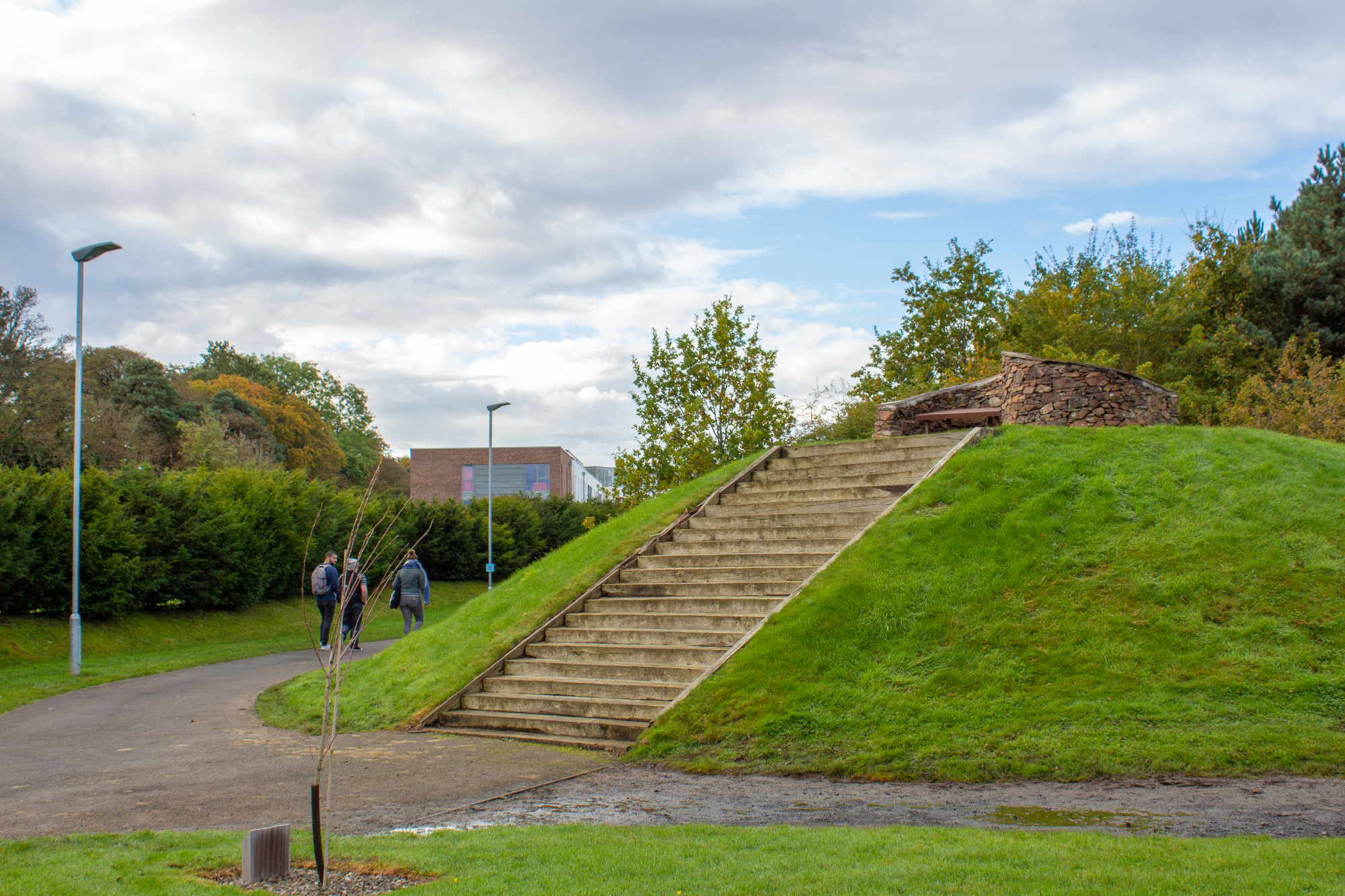 Steps ascending to a bench on a mound