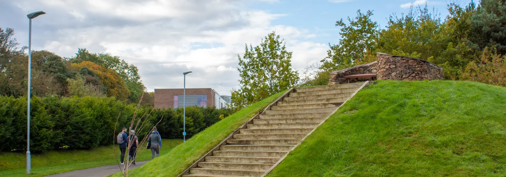 Steps ascending to a bench on a mound