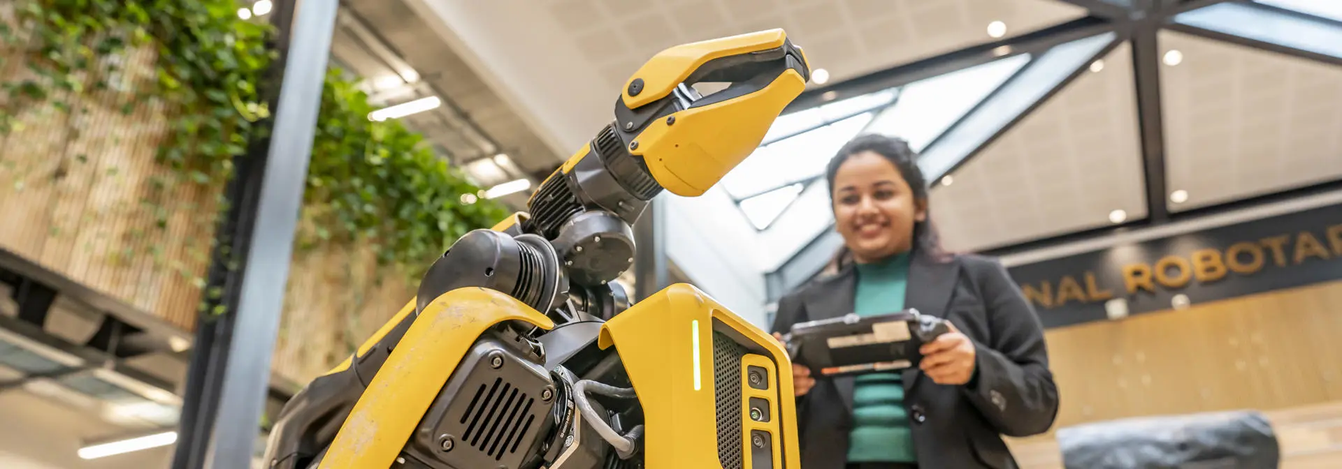 A student working with a robot