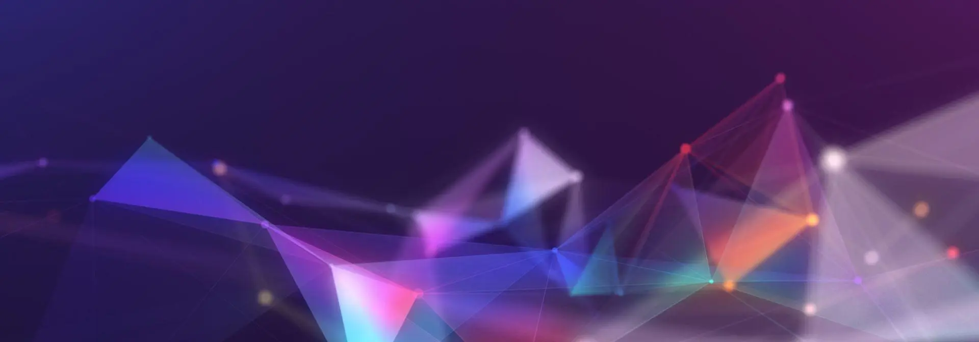 Abstract background featuring vibrant triangles and dynamic lines in a colourful arrangement.