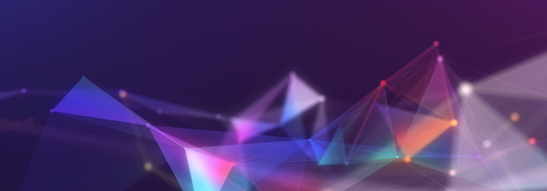 Abstract background featuring vibrant triangles and dynamic lines in a colourful arrangement.