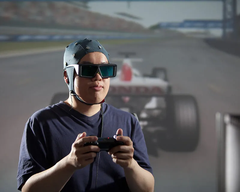 Student using game controller and software mapping headgear