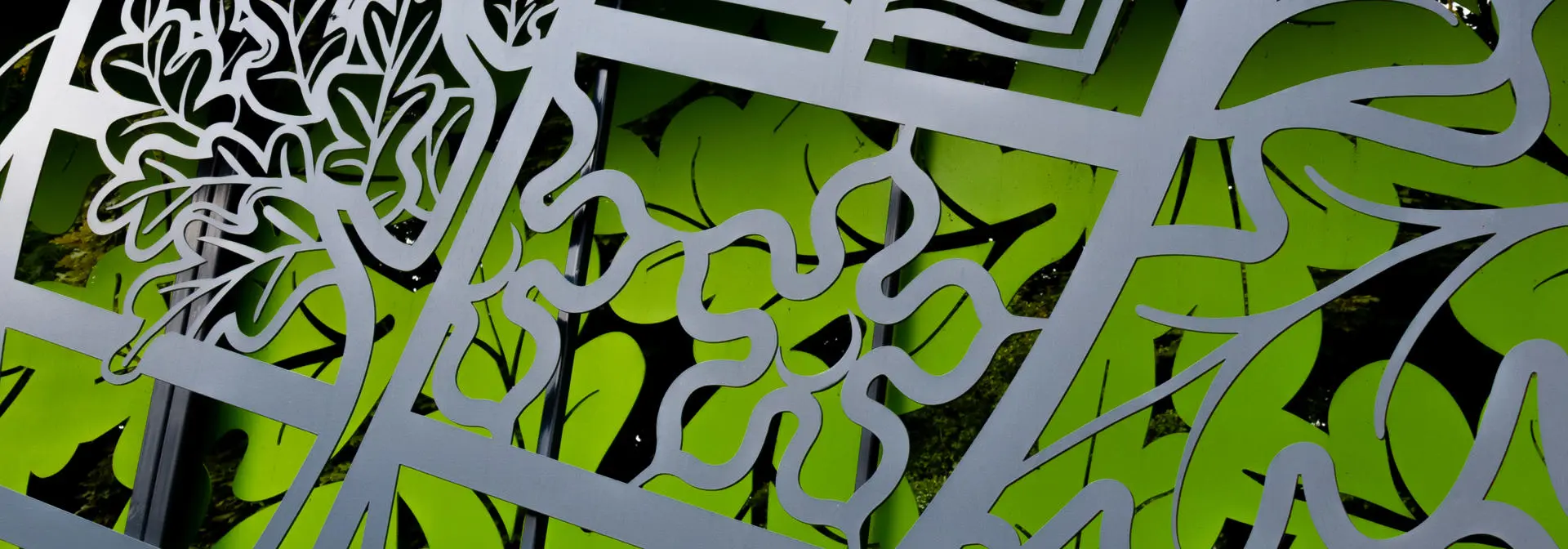 Close up picture of Heriot-Watt badge on wall display.