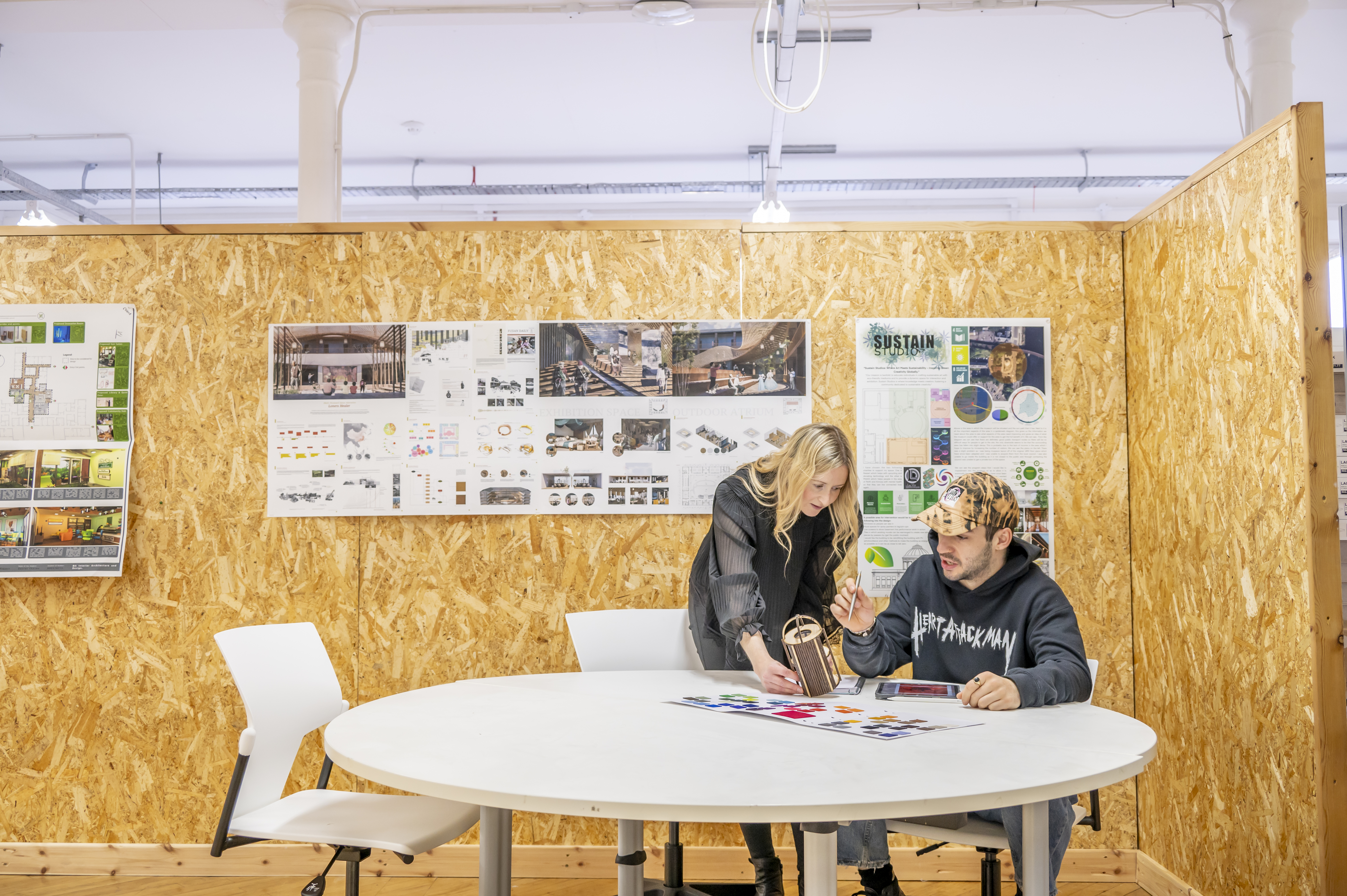 Two architecture students discussing design.