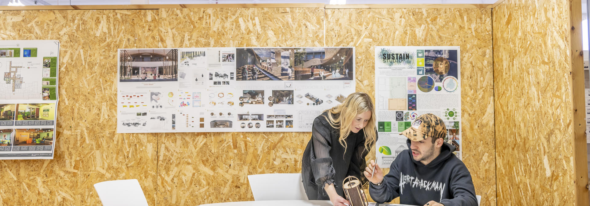 Two architecture students discussing design.