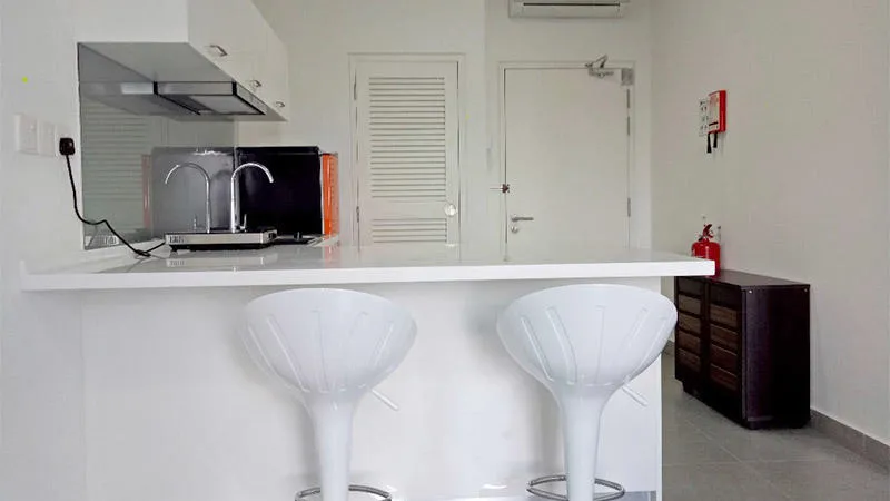 Kitchen area with bar stools