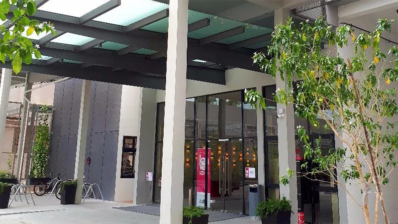 Entrance to lobby, with pillars and trees