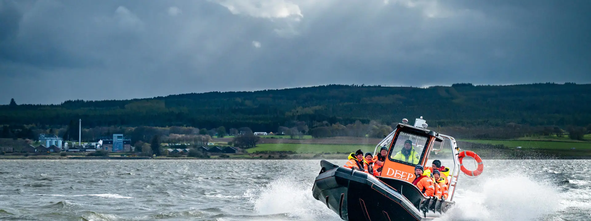 DEEP boat in front of Glenmorangie Distillery. Credit: Charné Hawkes Photography.