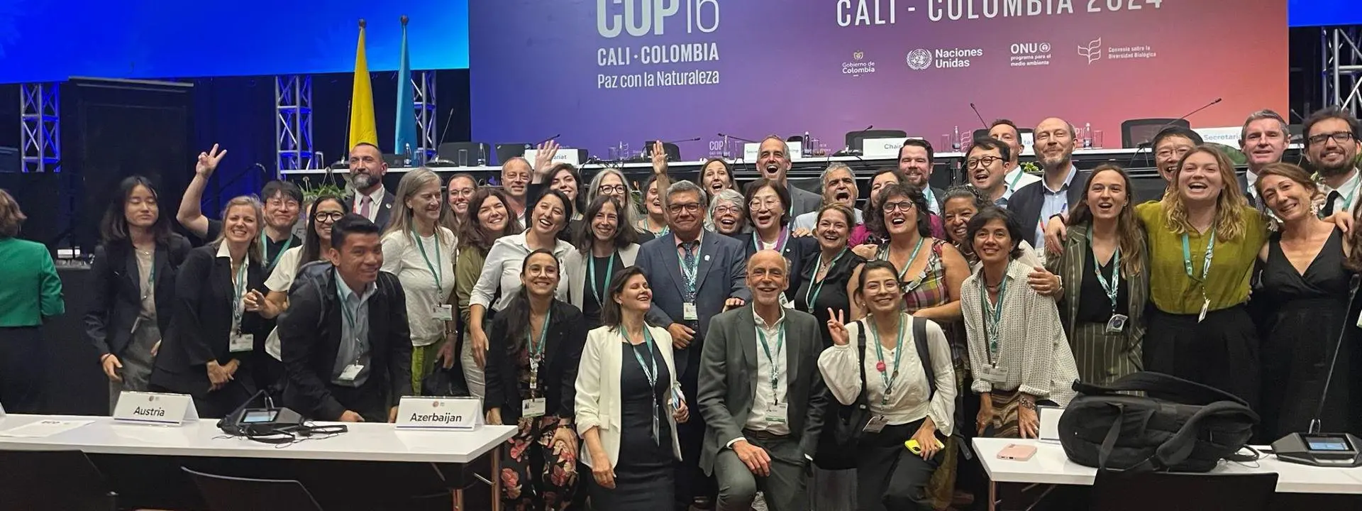 A large group of people posing at the United Nations Biodiversity Conference (COP16) in Cali, Colombia, 2024.