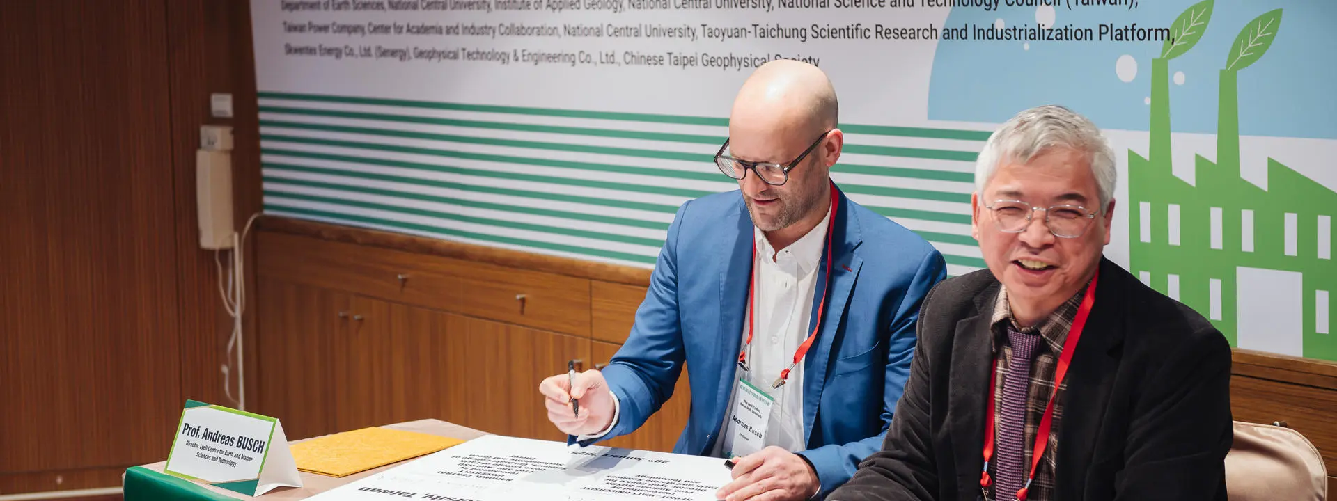 Two professors sign a memorandum of understanding