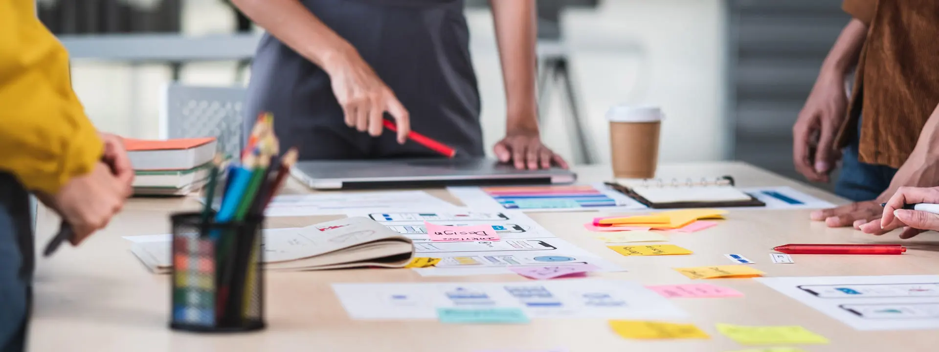 Close up ux developer and ui designer brainstorming