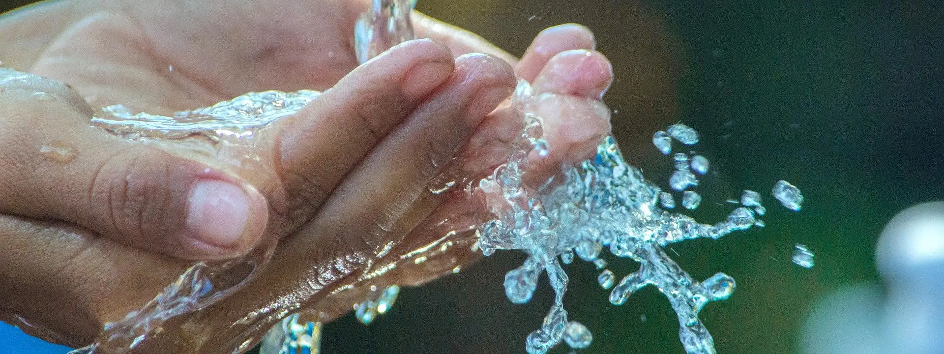 Hands under clean running water