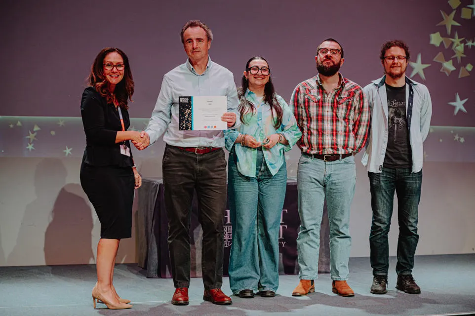 5 people receiving an award 