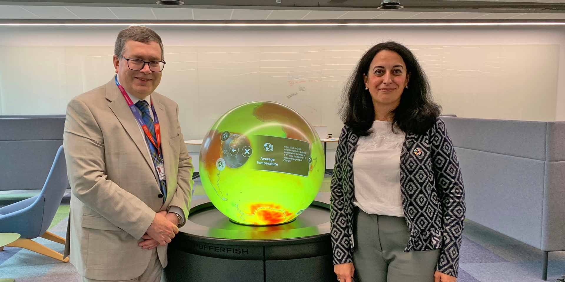 Professor Richard A. Williams (left) and Professor Mercedes Maroto-Valer stand either side of a thermal globe.