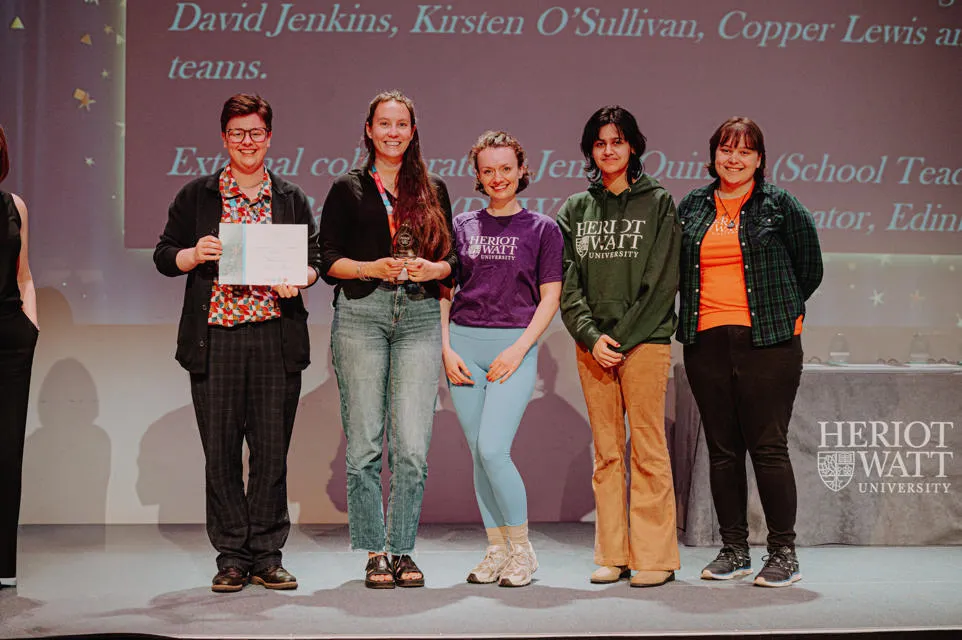 5 people receiving an award