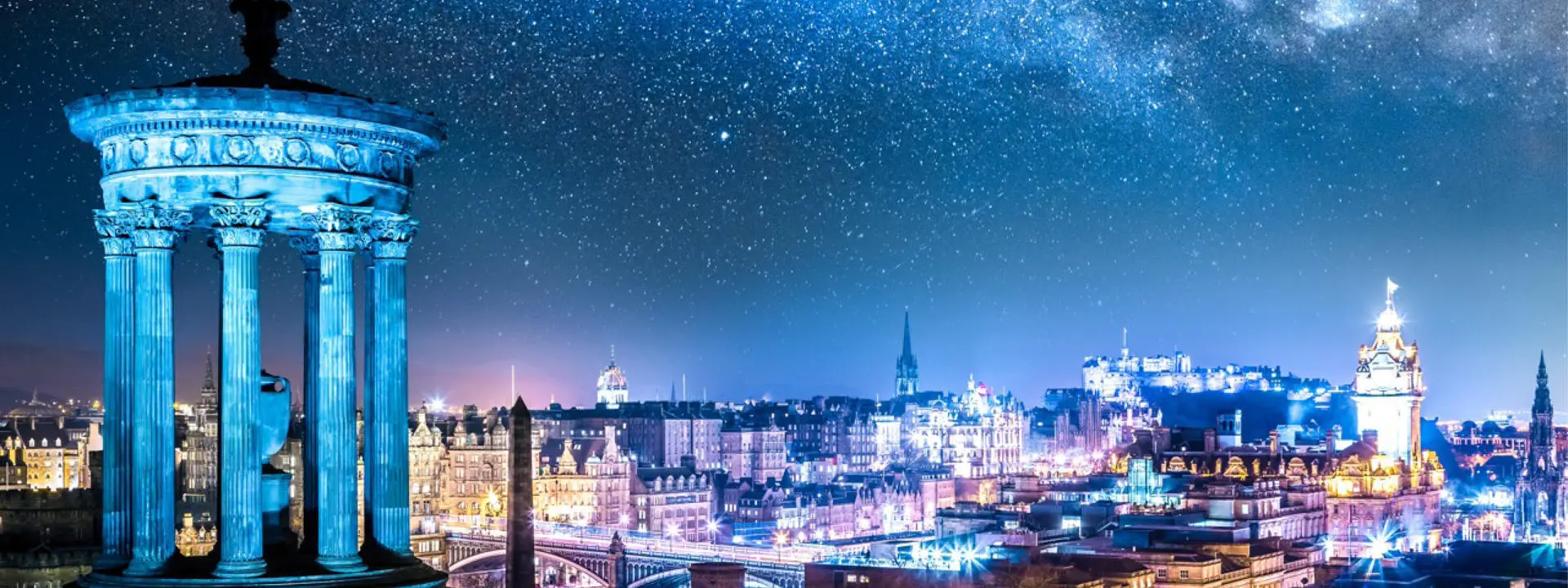 A nighttime view of the Edinburgh city skyline, pictured fro. the top of Calton Hill.