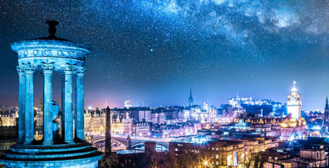 A nighttime view of the Edinburgh city skyline, pictured fro. the top of Calton Hill.