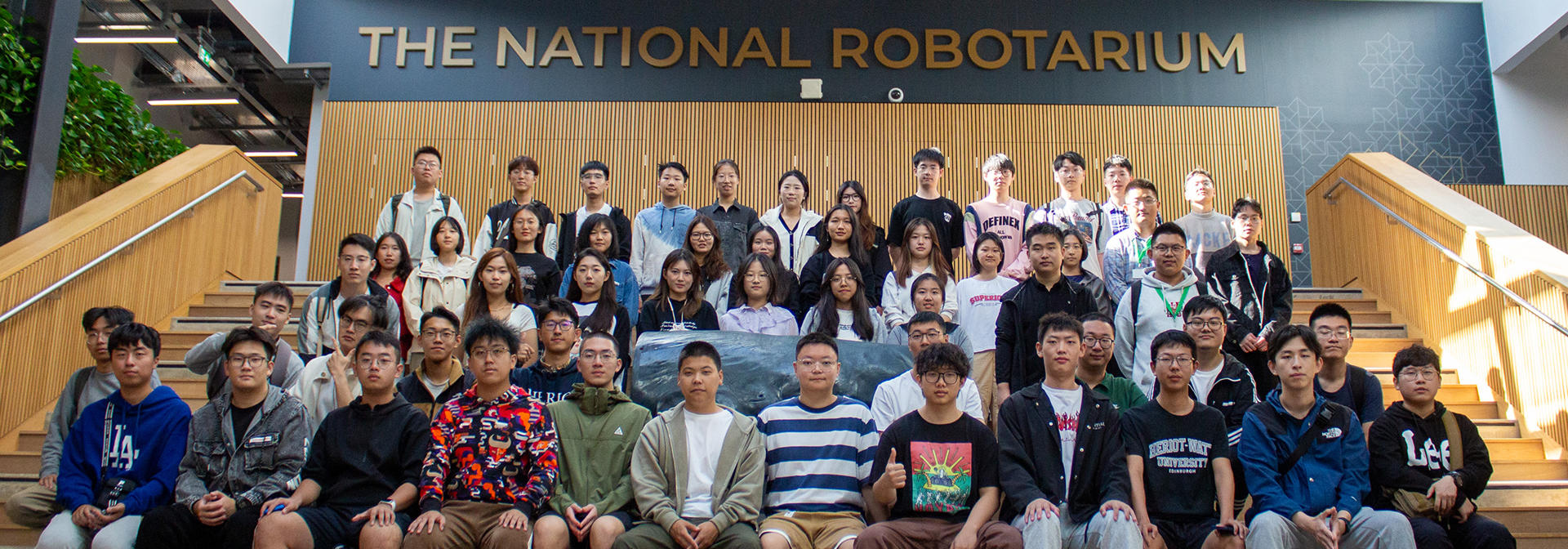Large group of students at the steps to the National Roboratrium