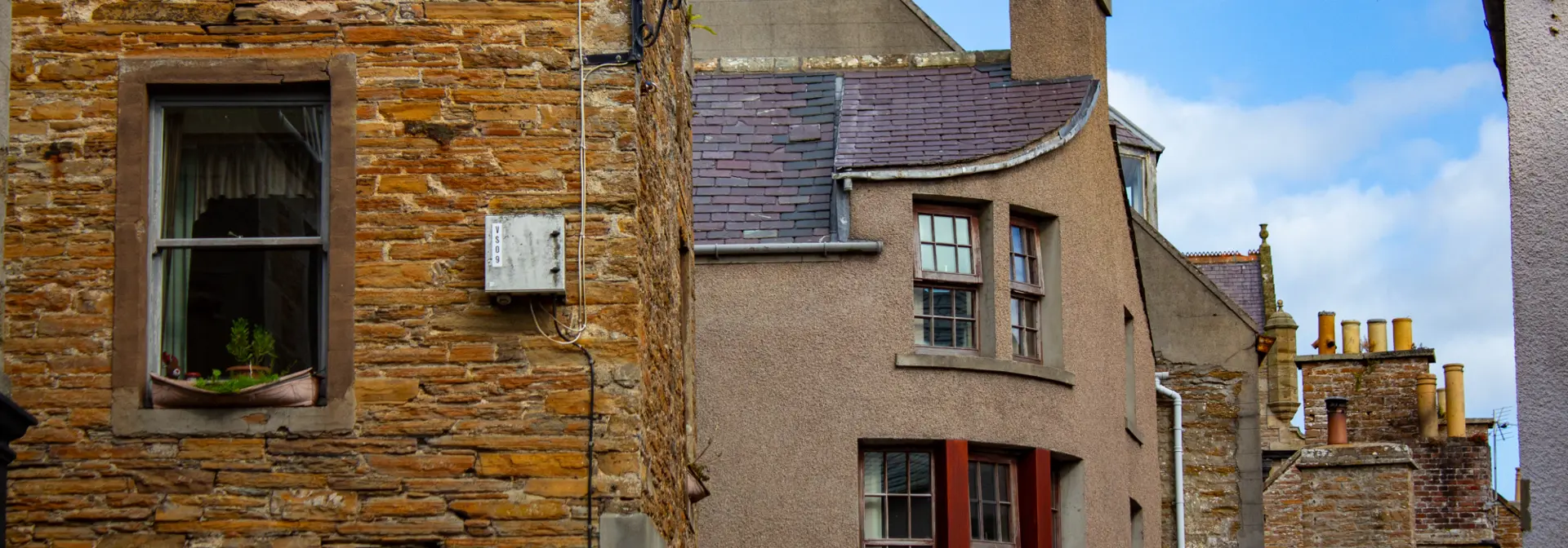 Old brown stone buildings in a town