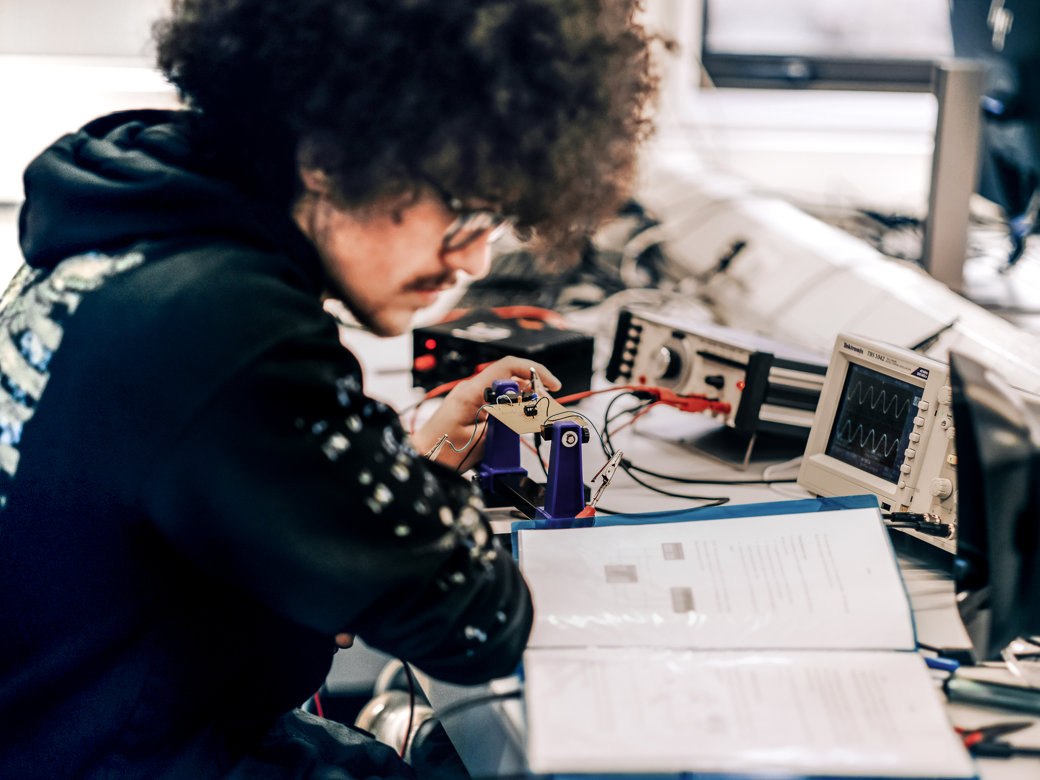 Physics student testing electrical current