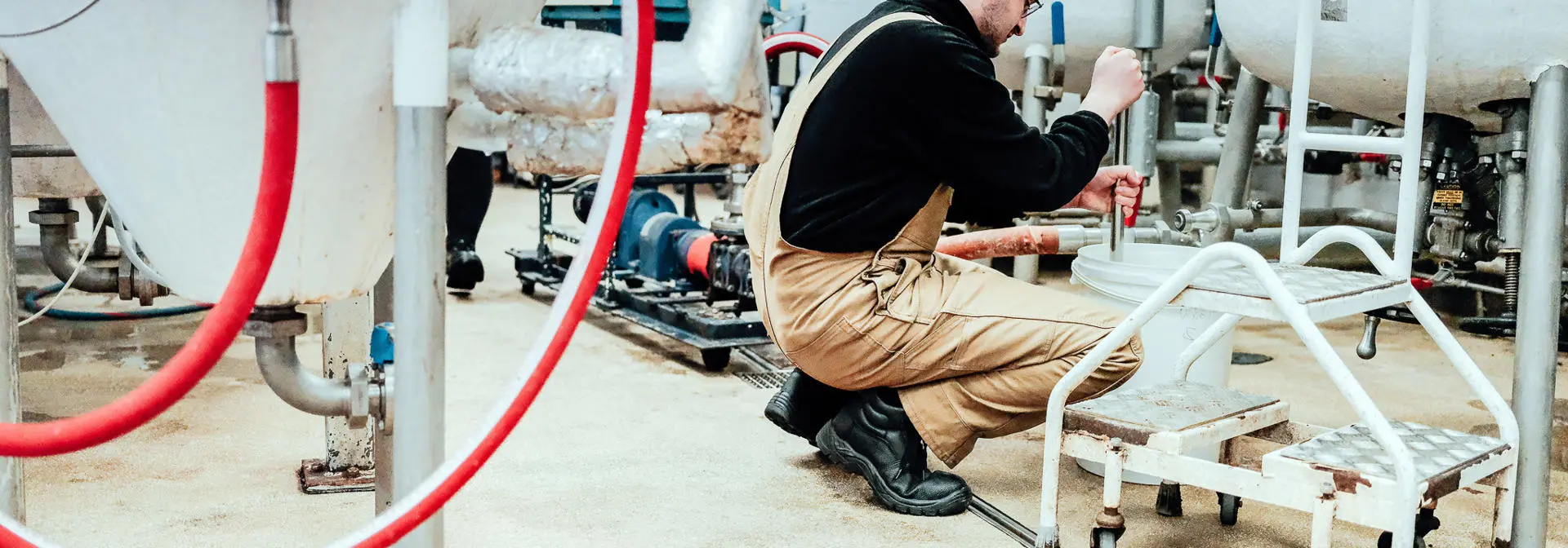 A student working in the on-campus brewing and distilling facility.