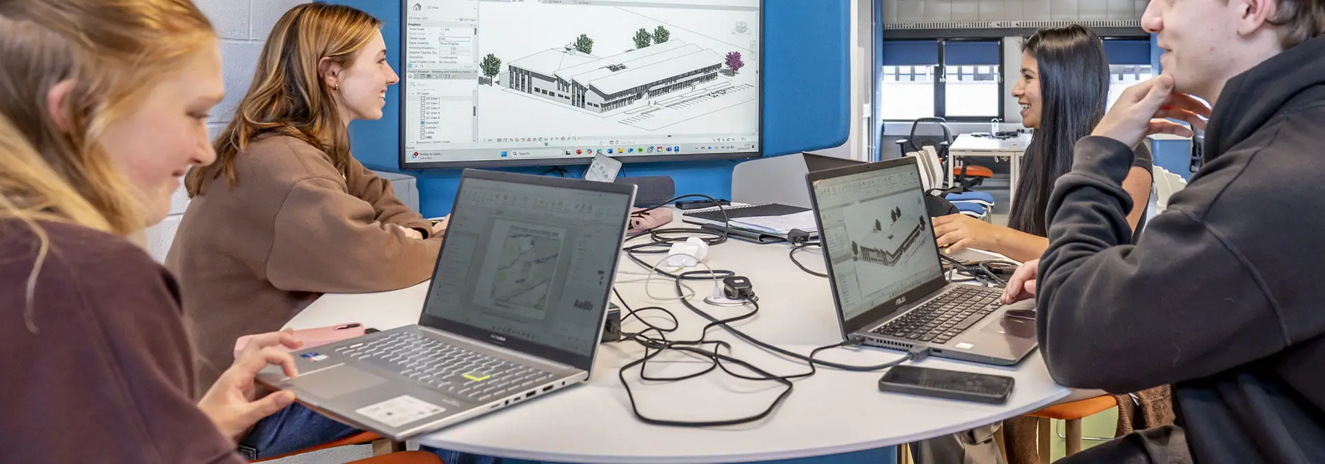 Students collaborate on a design project in the studio.