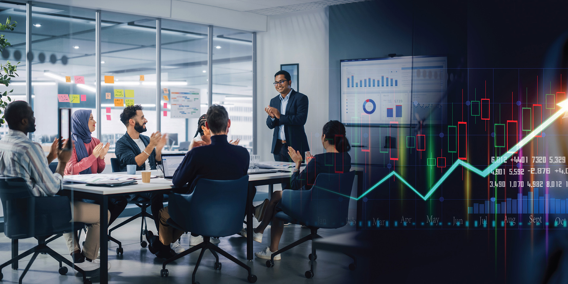 Business professionals discussing strategies in a meeting room, with a large upward graph displayed on the screen.
