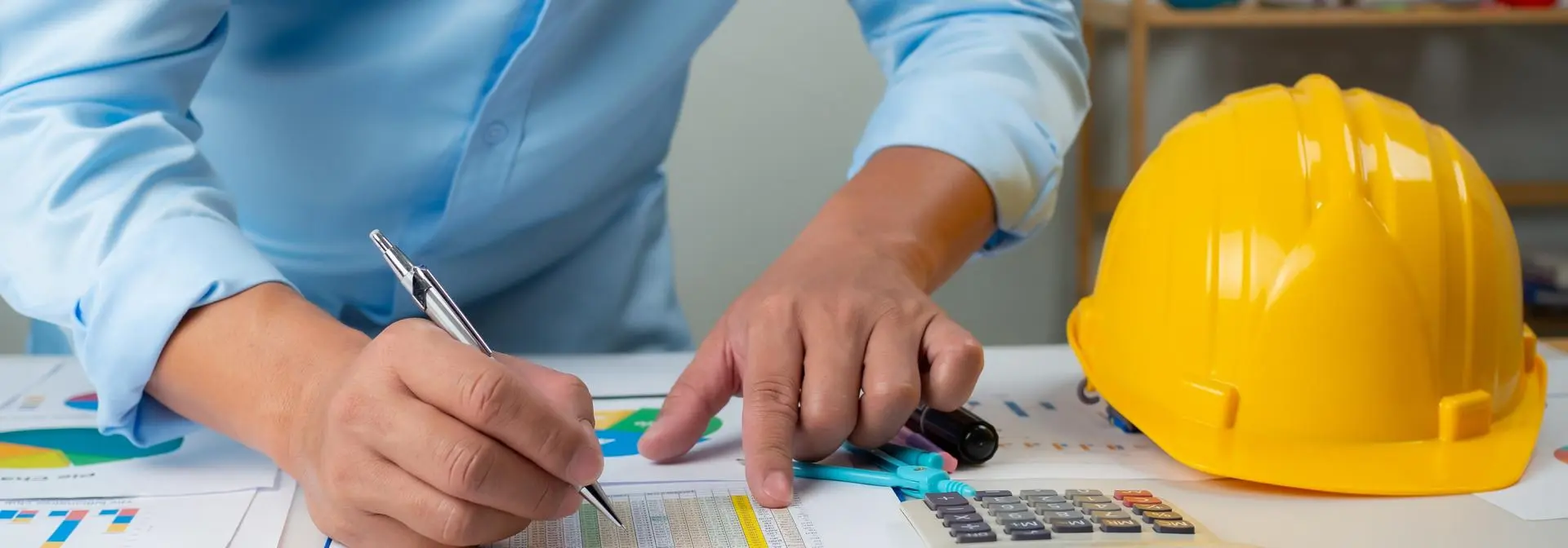 engineer looking at data on a paper
