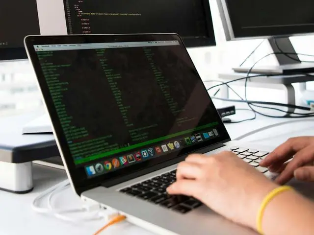 A developer working on a laptop