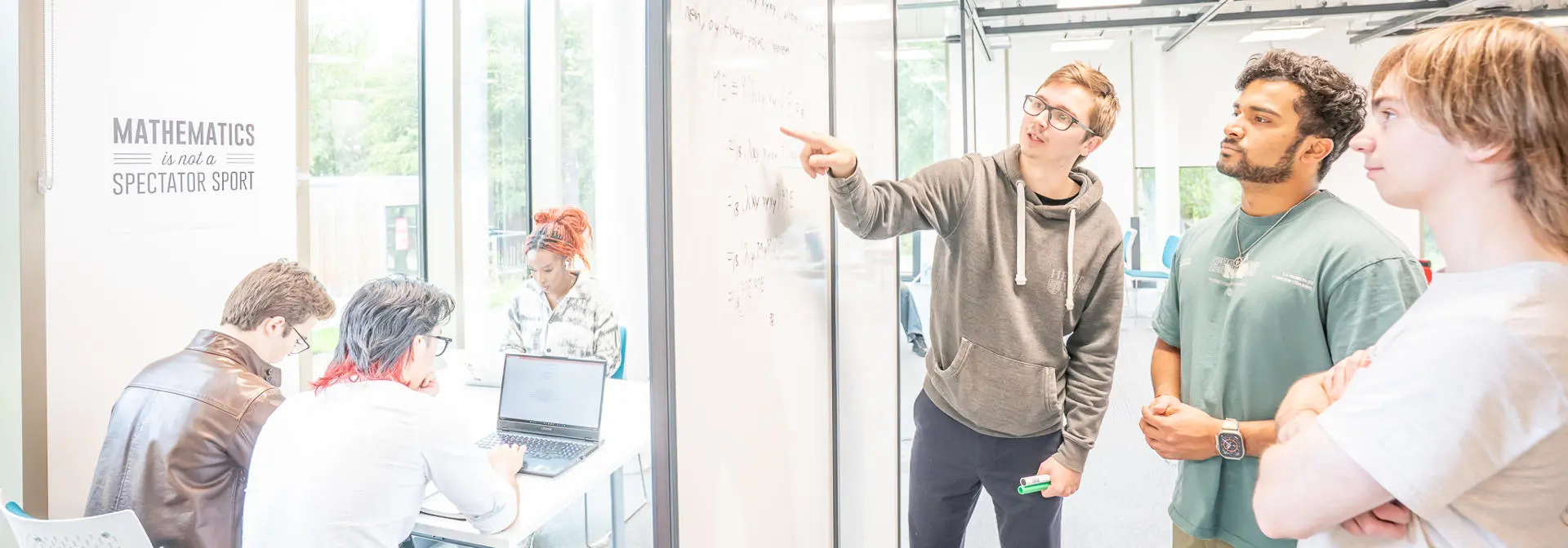 Students working on a problem together in a maths gym