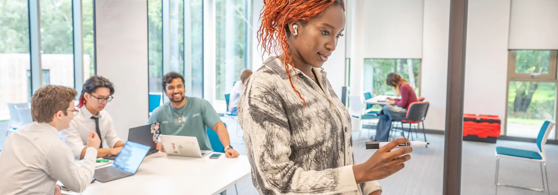 Student writing on a whiteboard
