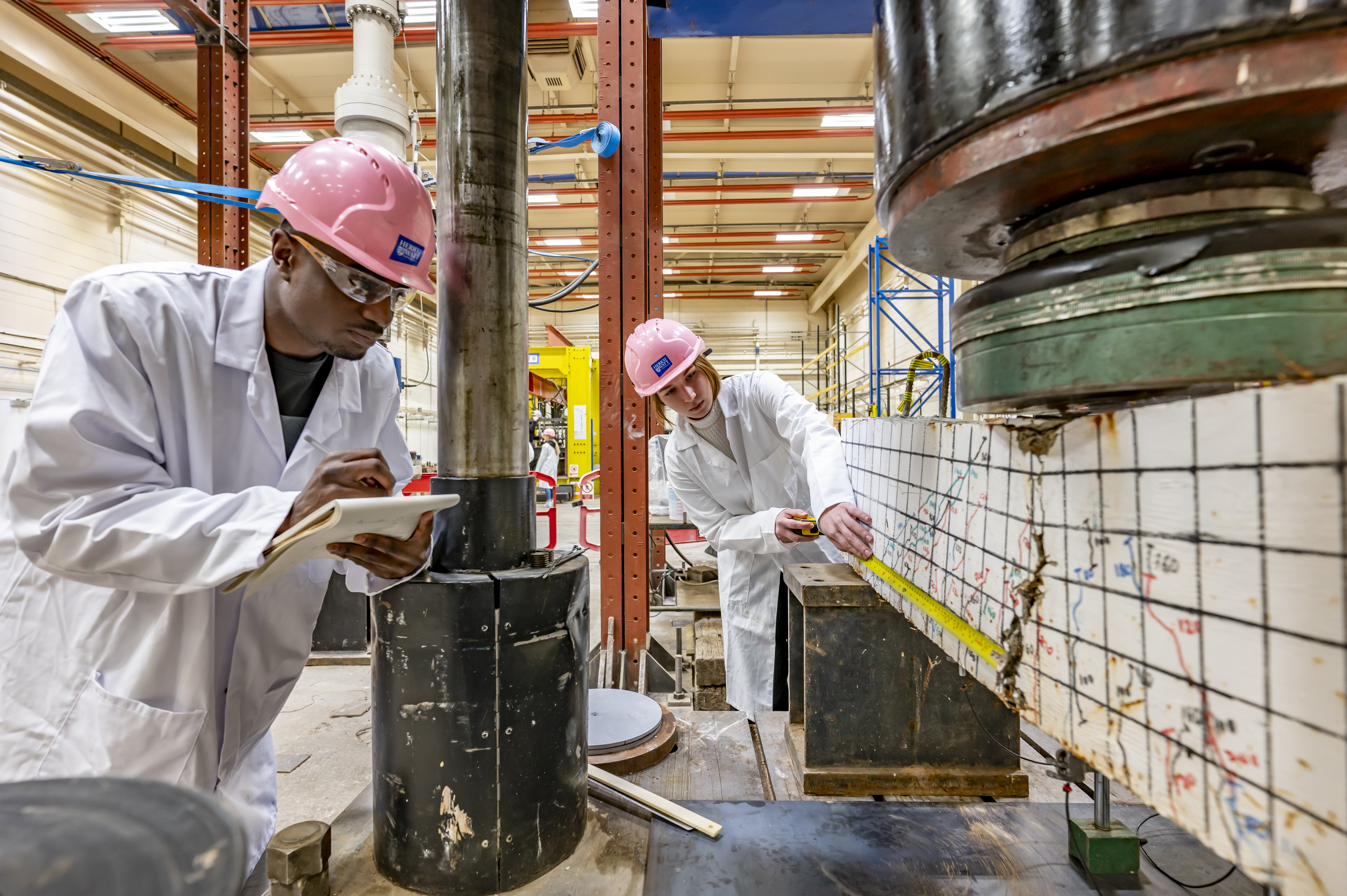 Civil Engineer Students in a Workshop Measuring Faults
