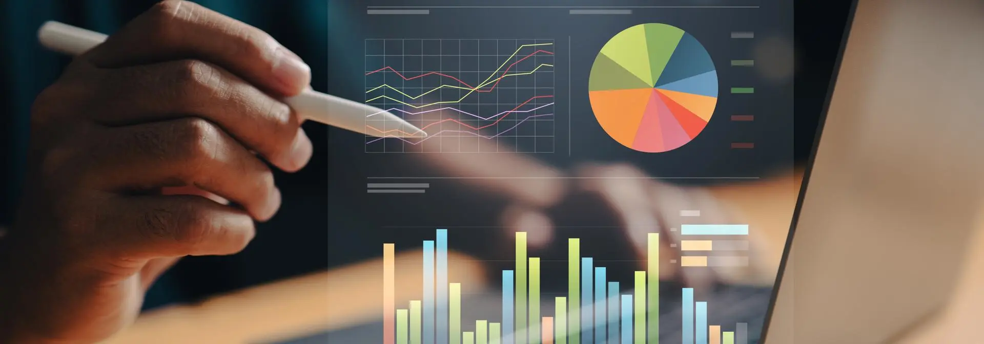 A person holds a pen over a laptop with a progress bar chart floating above the keyboard