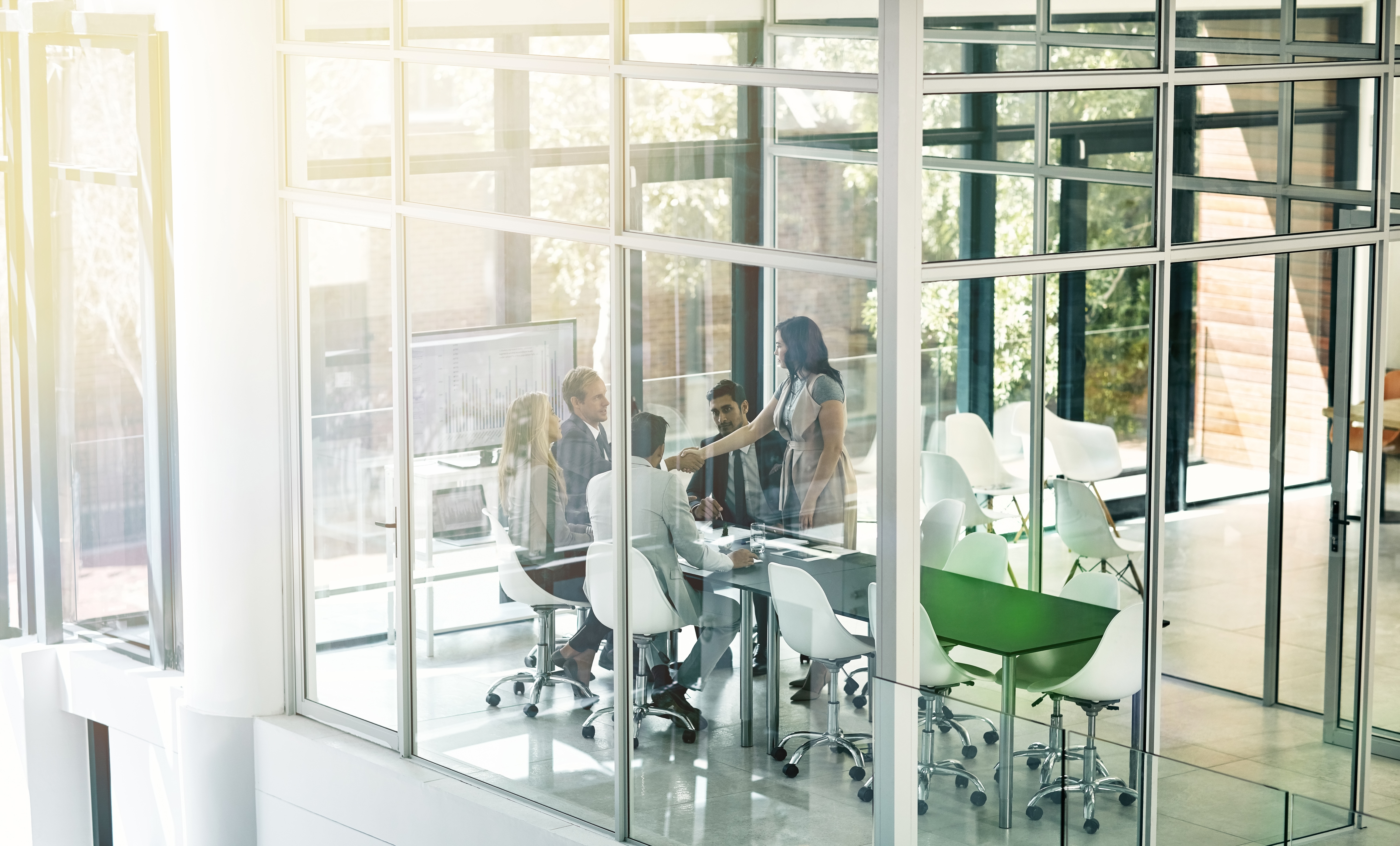Business meeting in a modern glass meeting room