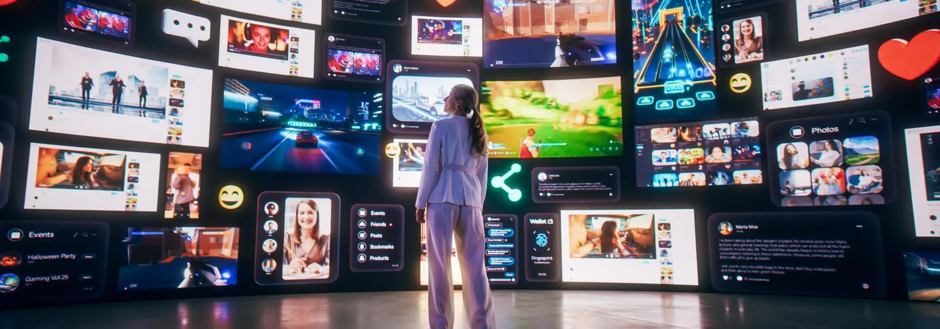 A person standing before a large, curved collage of screens with digital content representing a digital experience.