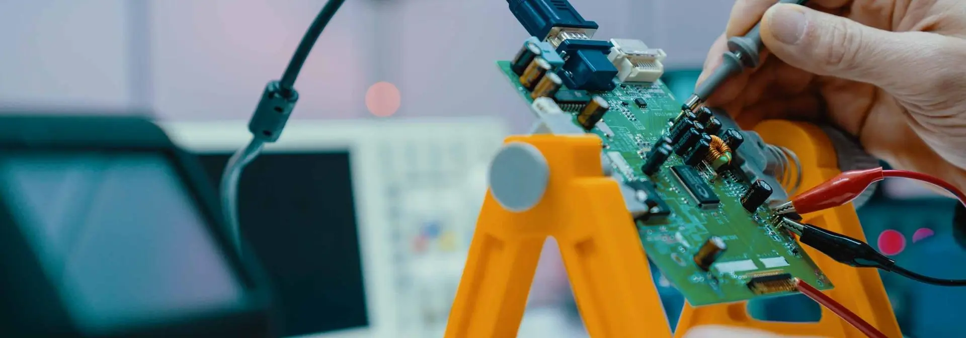 engineer testing continuity of a circuit board