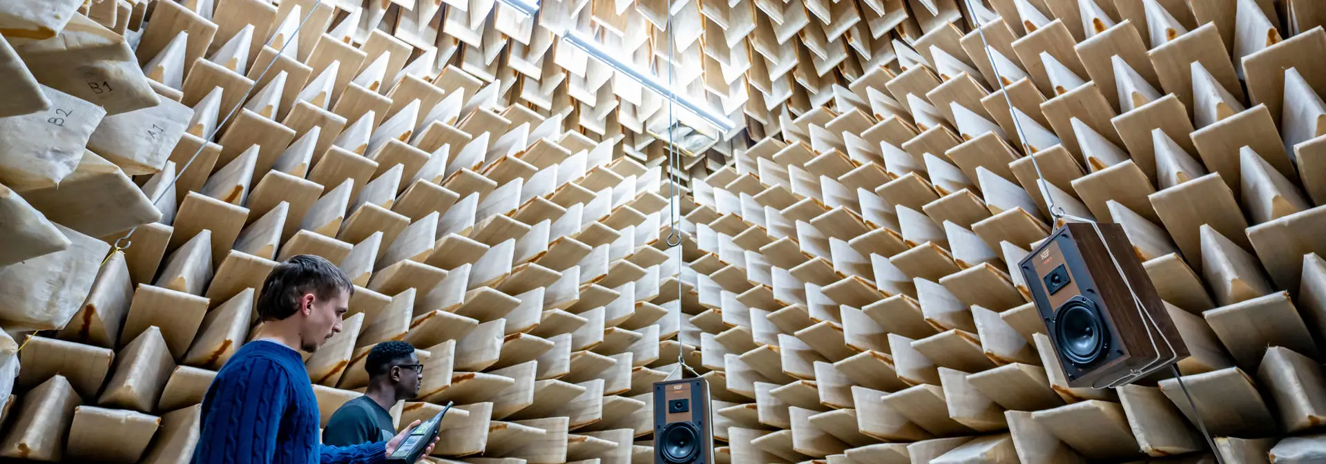 Two students taking measurements in the Acoustic Lab.