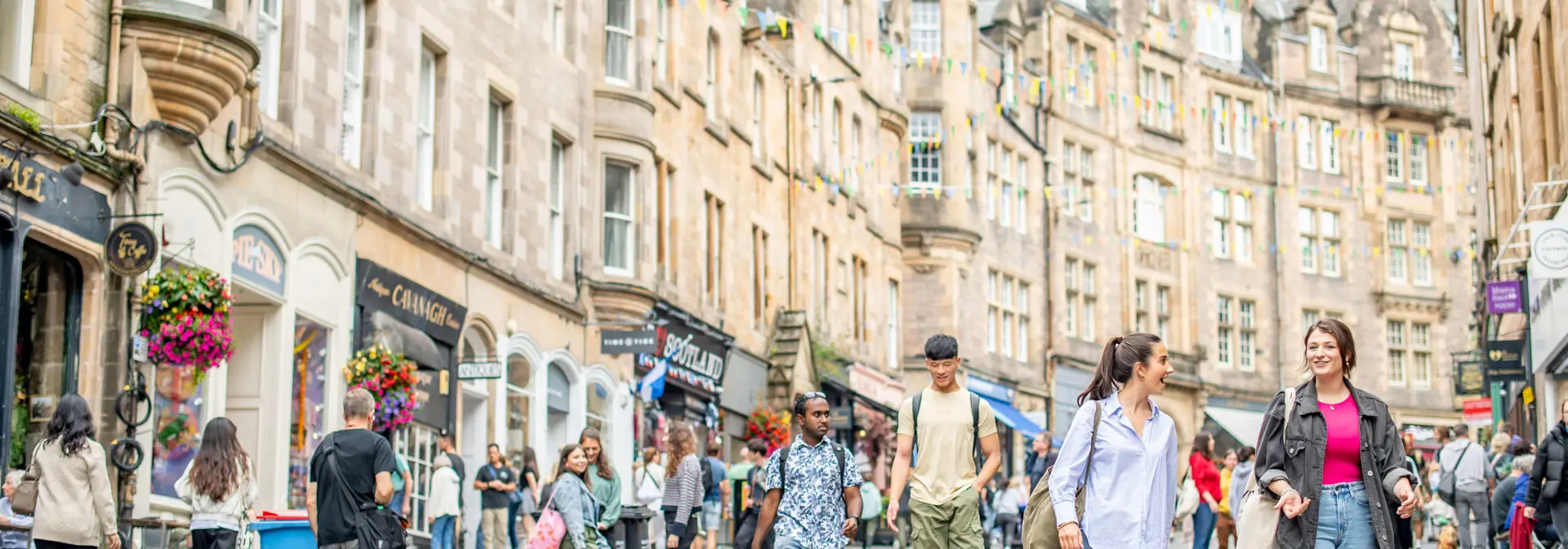Students chatting whilst walking down Cockburn Street in the City centre.