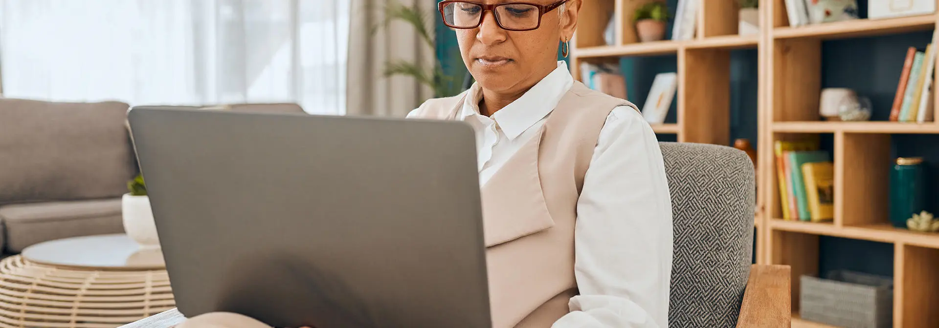 An individual working on a laptop in a psychologist office