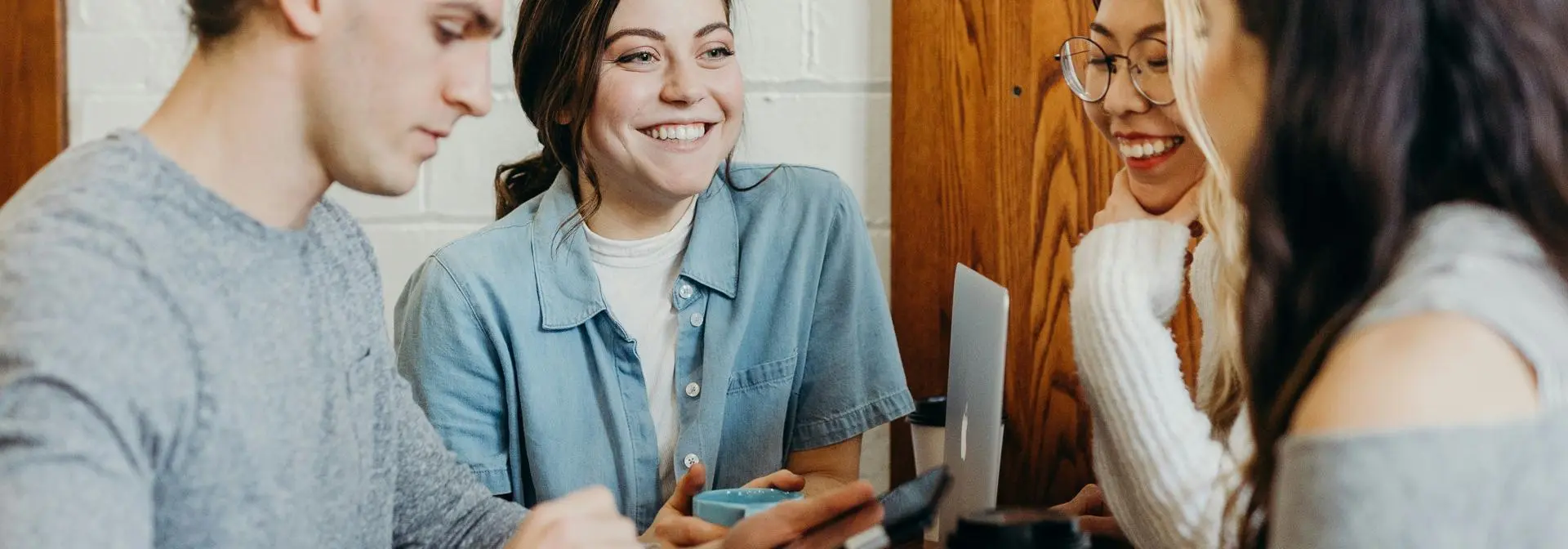 A group of students sitting around a table