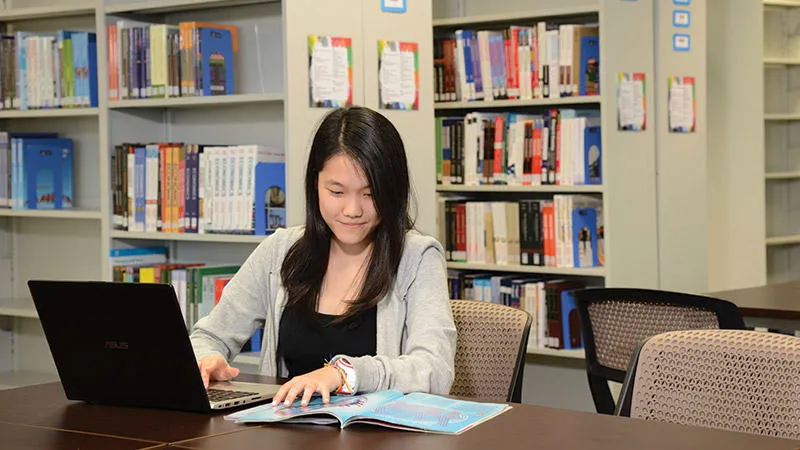 Student studying in Malaysia Campus library